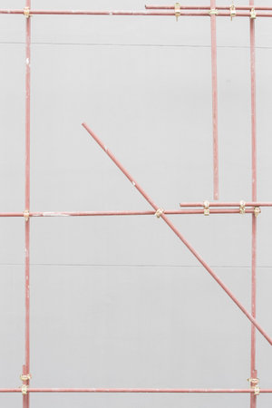 Metal prefabricated scaffolding at building construction site