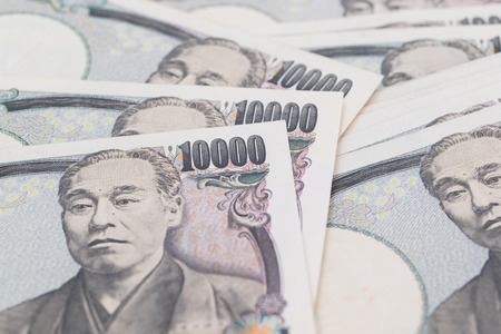 Japanese yen , Stack of Japanese currency yen bank notesの写真素材