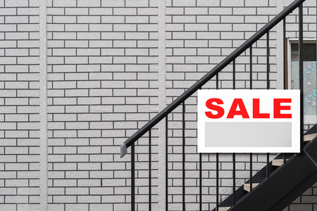 Sale Real Estate Sign in Front of houseの写真素材