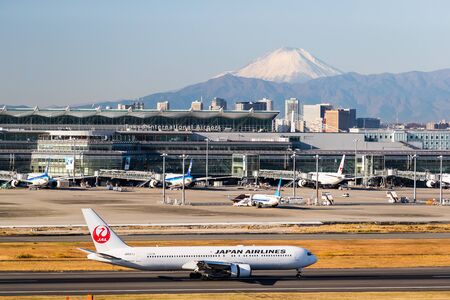 TOKYO, Japan - Dec 14, 2017: Haneda Airportand Mount Fuji ina clear day. Haneda or Tokyo International Airport is one of the two primary airports that serve the Greater Tokyo Area.のeditorial素材