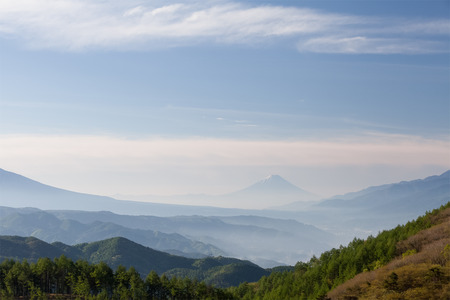 Mountain Fuji with morning mist in spring seasonの写真素材