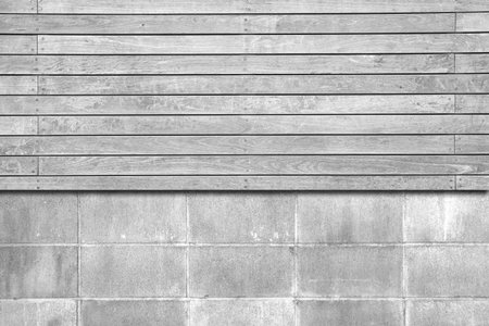 White wood fence and cement block wall background