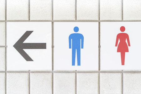 Entrance sign to the toilet and white wallの写真素材