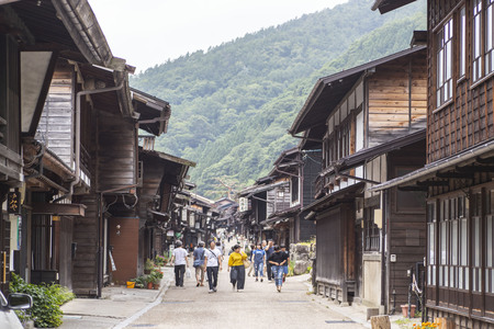 Narai-juku, Japan - June 28, 2018: Picturesque view of old Japanese town with traditional wooden architecture. Narai-juku post town in Kiso Valley, Japanのeditorial素材
