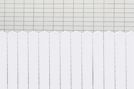 White wood fence and stone brick wall background and textureの写真素材