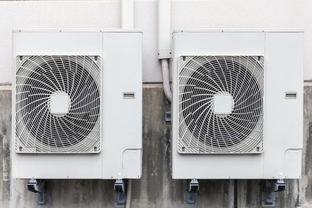 Air compressor installation on building wallの写真素材