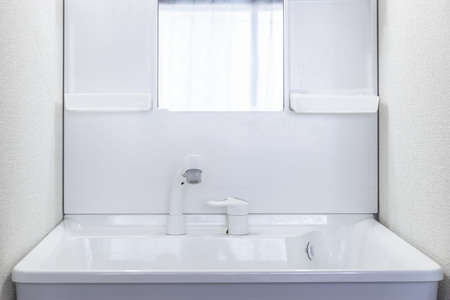 New white ceramic wash basin, clean and plastic lockersの写真素材