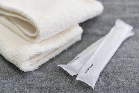 Toothbrushes and towels placed togetherの写真素材