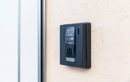 Close - up at Security intercom button in the apartment door