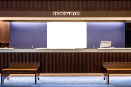 Blank advertising signs placed behind the reception counter at the office buildingの写真素材