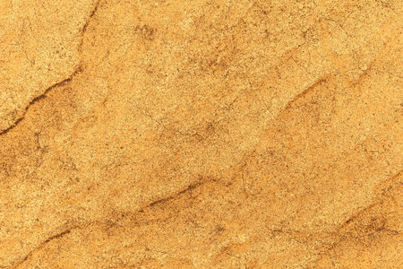 Patterned cement wall Vintage yellow painted texture and background