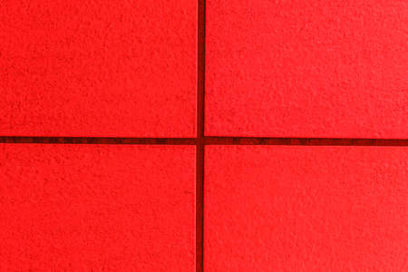 Red marble stone tile floor texture and seamless backgroundの写真素材