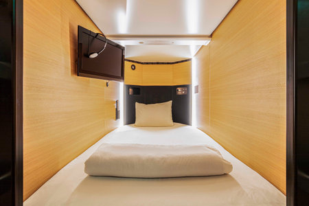 Interior picture of a small mattress of a capsule hotel in Japanの写真素材
