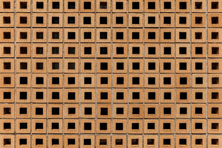 Brown stone block wall seamless background and pattern textureの写真素材