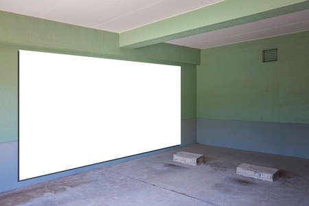 Large blank billboard on the wall of the basement car parkの写真素材