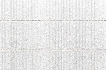 Modern white stone wall with stripes texture and seamless background