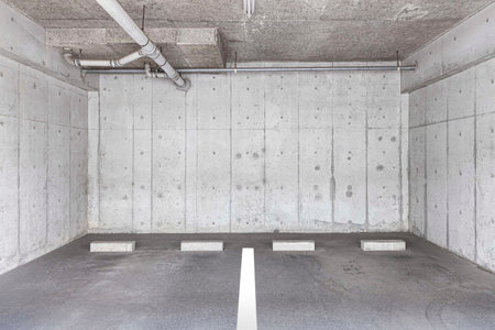 Empty small Parking on the ground floor below the apartment buildingの写真素材
