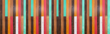 Panorama of Vintage multi-colored wooden wall pattern and seamless background