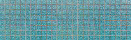 Panorama of green stone block wall seamless background and pattern texture
