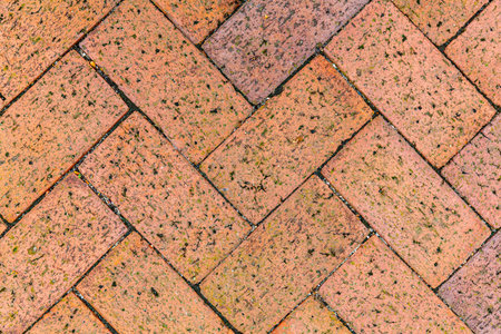 Vintage brown cobblestone pavement pattern and background