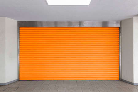 A brown shutter door close at an industrial warehouseの写真素材