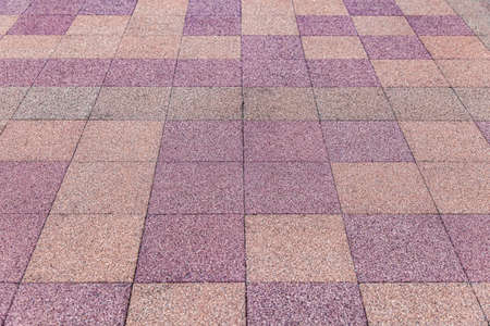 Vintage red and yellow cobblestone pavement pattern and backgroundの写真素材