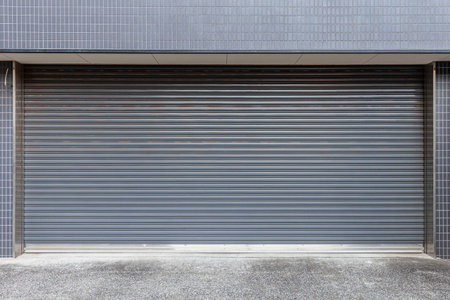 Automatic white roller shutter doors on the ground floor of the house