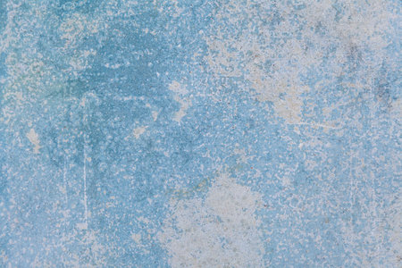 Old cement wall painted in light blue vintage texture and backgroundの写真素材