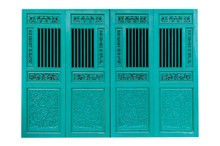 Chinese traditional green hinge carved wood door isolated on a white backgroundの写真素材