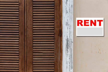 Rental sign attached to the front of the shopの写真素材
