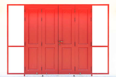 Vintage red wooden door and cream colored old plaster wall isolated on a white backgroundの写真素材