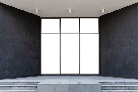 Large aluminum door frames and black stone walls at the entrance to the building