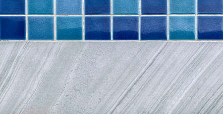 Panorama of Blue glazed tiles and white granite tiles beside the swimming pool pattern and background seamlessの写真素材