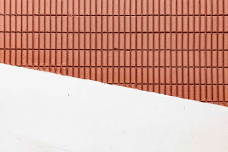 Red-brown terracotta block wall and white cement wall pattern and background seamlessの写真素材