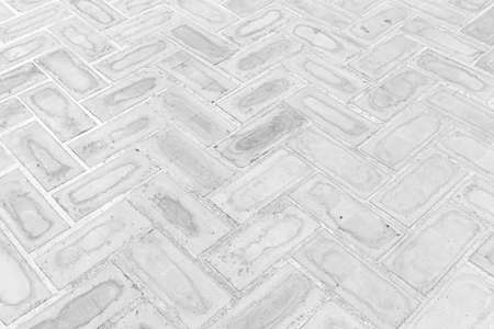 Perspective View Monotone Gray Brick Stone Pavement on The Ground for Street Roadの写真素材