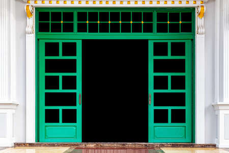 Large green wooden door entrance to the buildingの写真素材