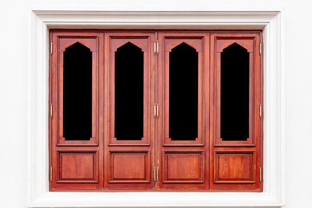 Vintage brown painted wooden window frame and white cement wallの写真素材