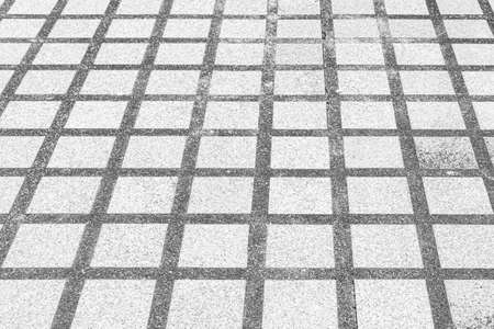 Perspective View Monotone white Brick Stone Pavement on The Ground for Street Roadの写真素材