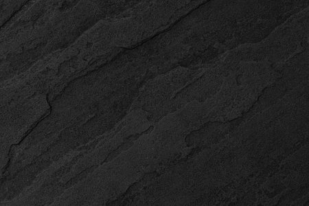 Dark grey black slate background or texture. Black granite slabs background