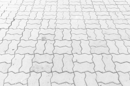 Perspective View Monotone white Brick Stone Pavement on The Ground for Street Roadの写真素材