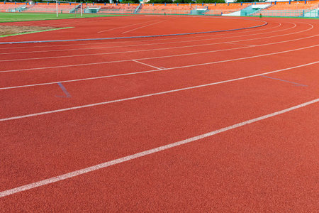 The curved lane in running track or athlete track in stadium. Running track is a rubberized...