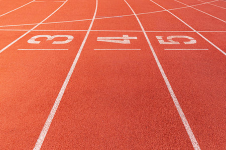 The curved lane in running track or athlete track in stadium. Running track is a rubberized...