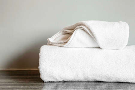Close - up Clean white towel fold in hotel roomの写真素材