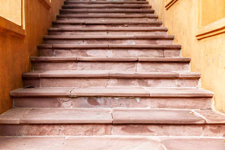 Building exterior stairs with antique red brown granite tilesの写真素材