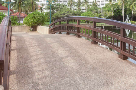 Concrete bridge and wooden railings at the parkの写真素材
