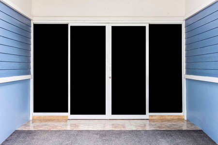 White aluminum sliding door entrance to the house