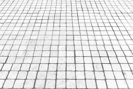 Perspective View Monotone white Brick Stone Pavement on The Ground for Street Roadの写真素材