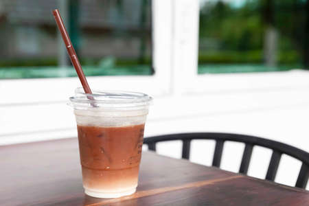 Iced cappuccino in a plastic take-out cupの写真素材