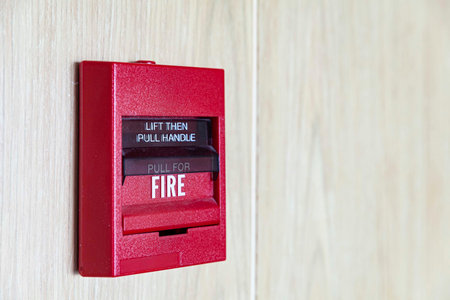 Fire alarm switch on the white wood wallの写真素材
