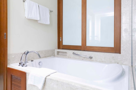 A large white bathtub in a luxurious bathroomの写真素材